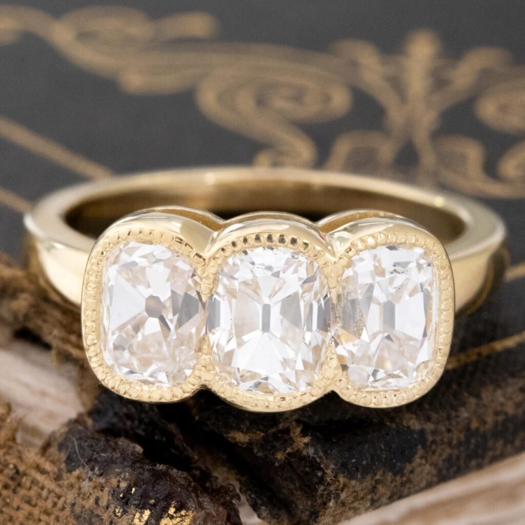 2.55ctw Elongated Old Mine Cut Diamond Trilogy Bezel Ring